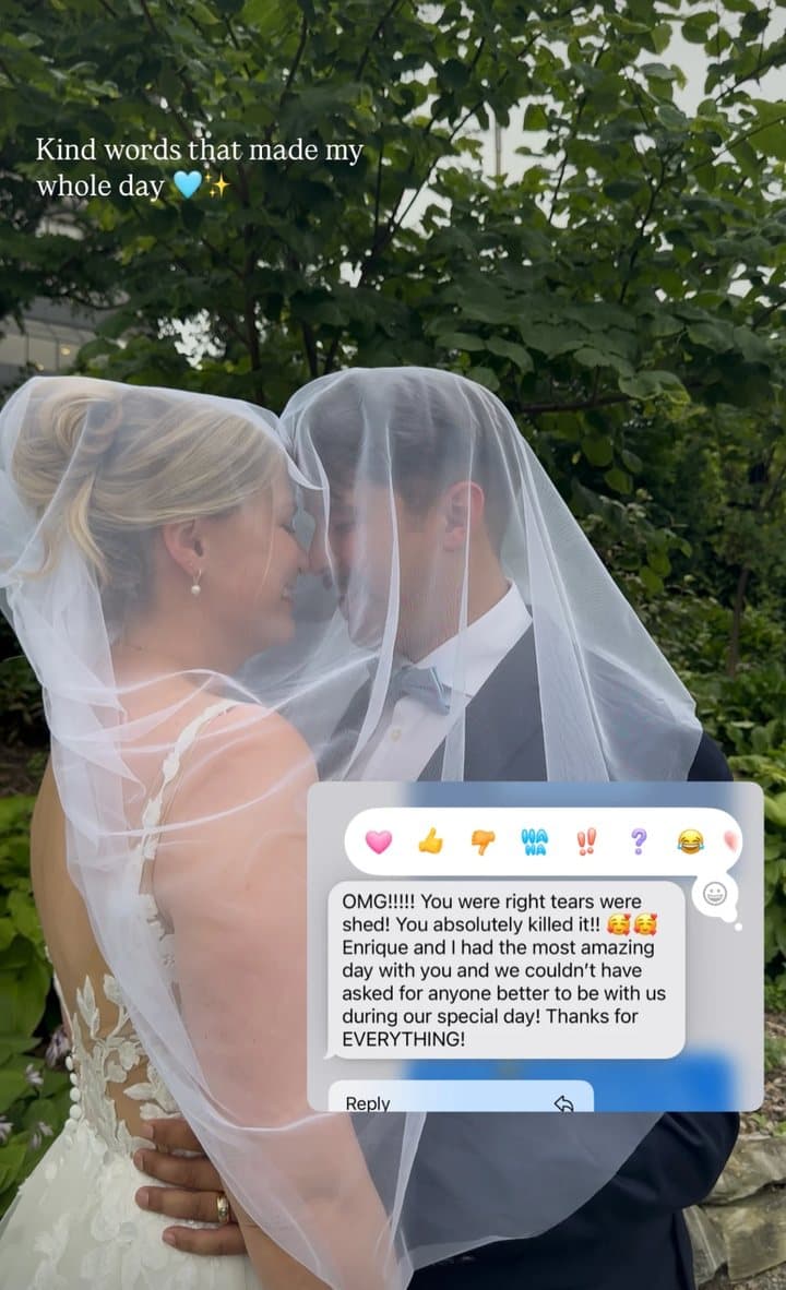 A couple beneath the veil with a message reading OMG!!!!! You were right tears were shed! You absolutely killed it!! Enrique and I had the most amazing day with you